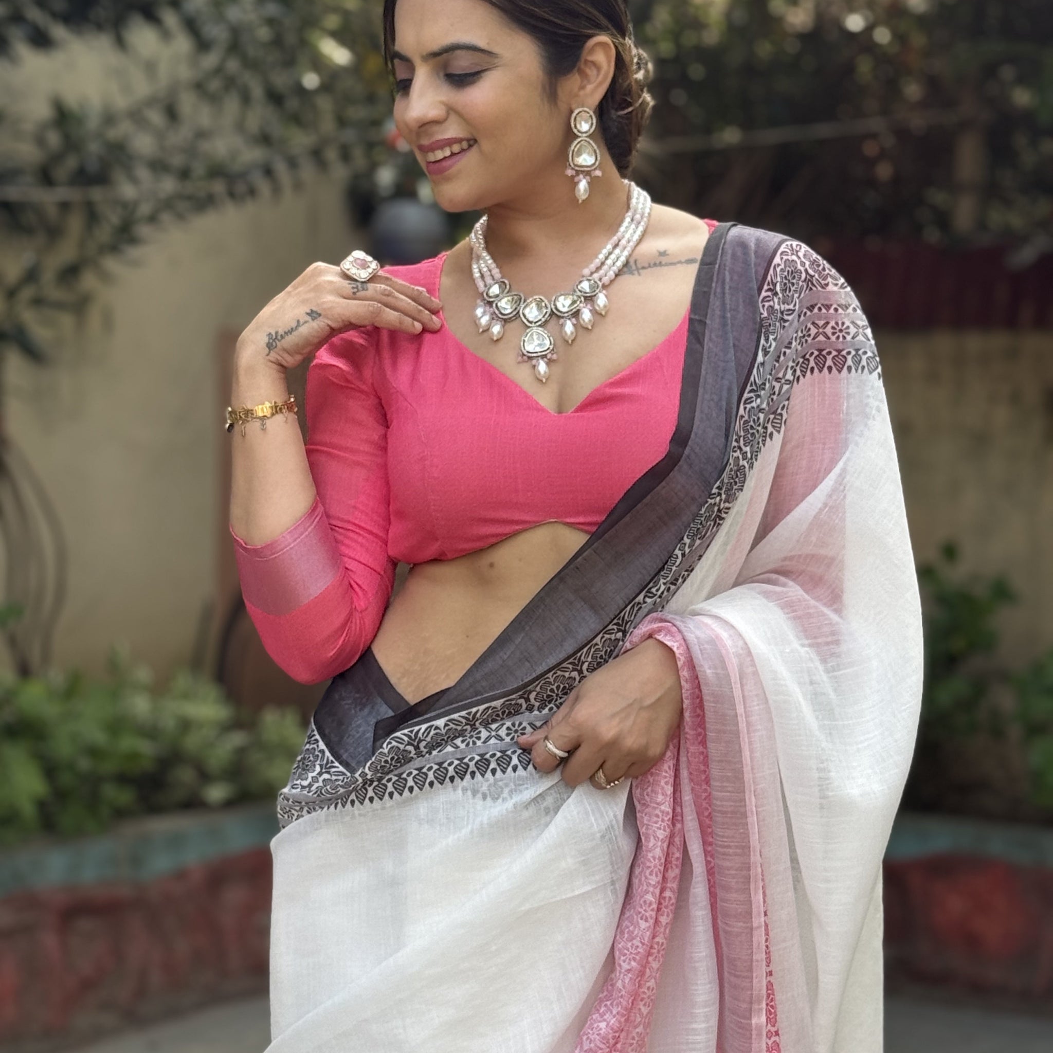 Elegant White and Pink Pure Linen Digital Printed Saree with Black Border, Tassels, and Blouse Piece – Intricate Floral and Geometric Design
