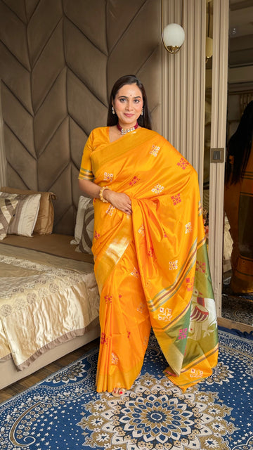 Orange Soft Silk Ikkat Patola Saree with Meenakari Motifs Peacock Pallu and Gold Zari Border