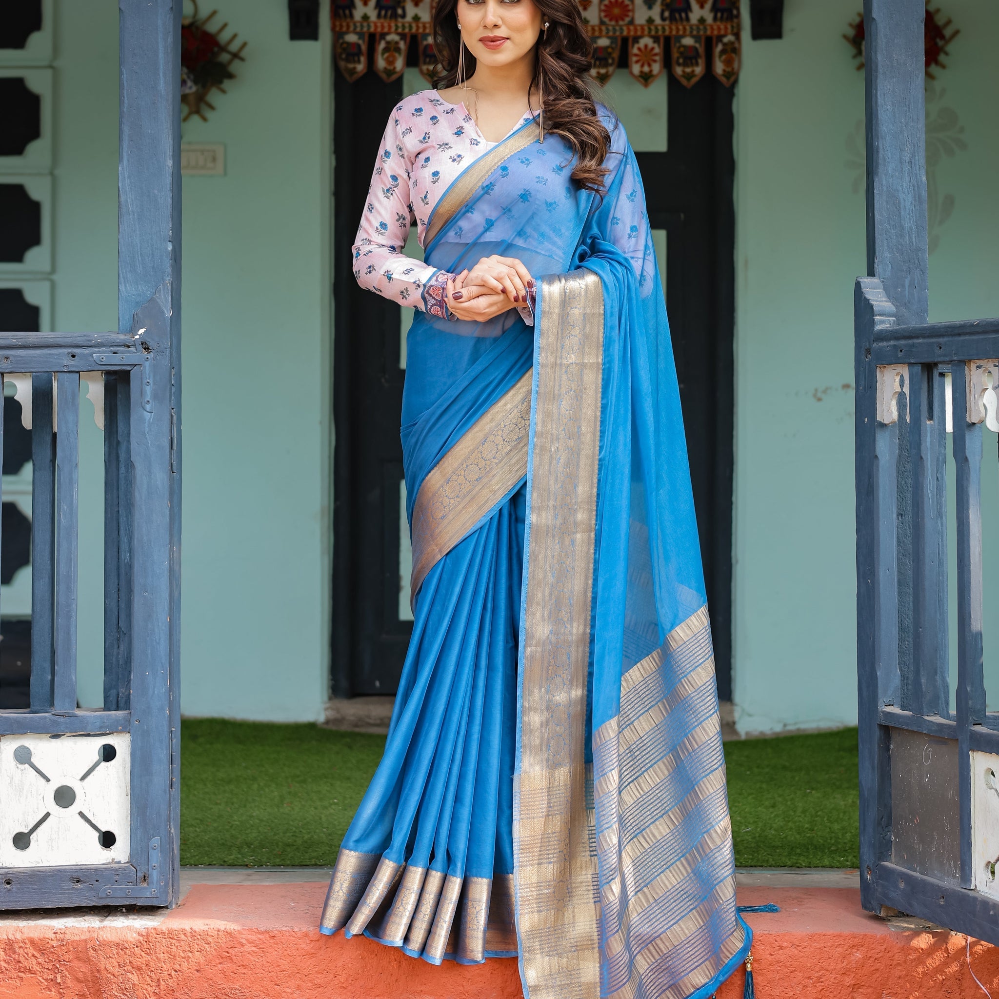 Vibrant Sky Blue Plain Chiffon Saree with Gold Zari Border, Floral Printed Blouse & Tassel Accents