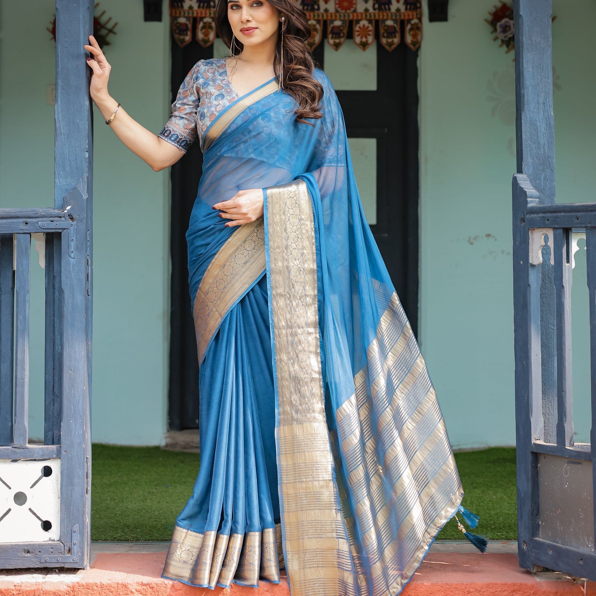 Vibrant Peacock Blue Plain Chiffon Saree with Gold Zari Border, Floral Printed Blouse & Tassel Accents
