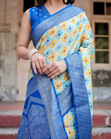 Yellow and Blue Ikat Digital Print Banarasi Silk Saree with Zari Weave and Tassel-Embellished Pallu
