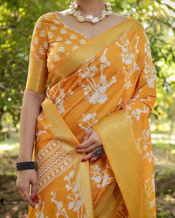 Sunshine Yellow Tussar Silk Saree with White Floral Motifs, Lustrous Zari Border, and Graceful Tassel Pallu