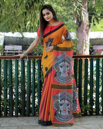 Yellow and orange durga face pallu linen saree